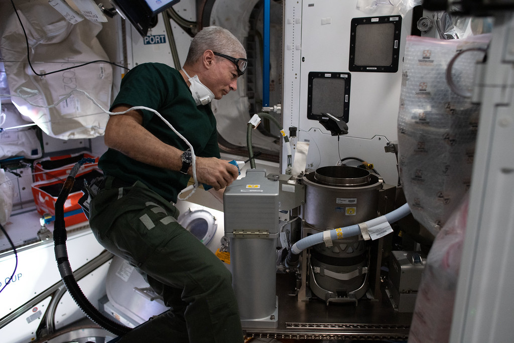 Astronaut Mark Vande Hei works on an advanced new toilet